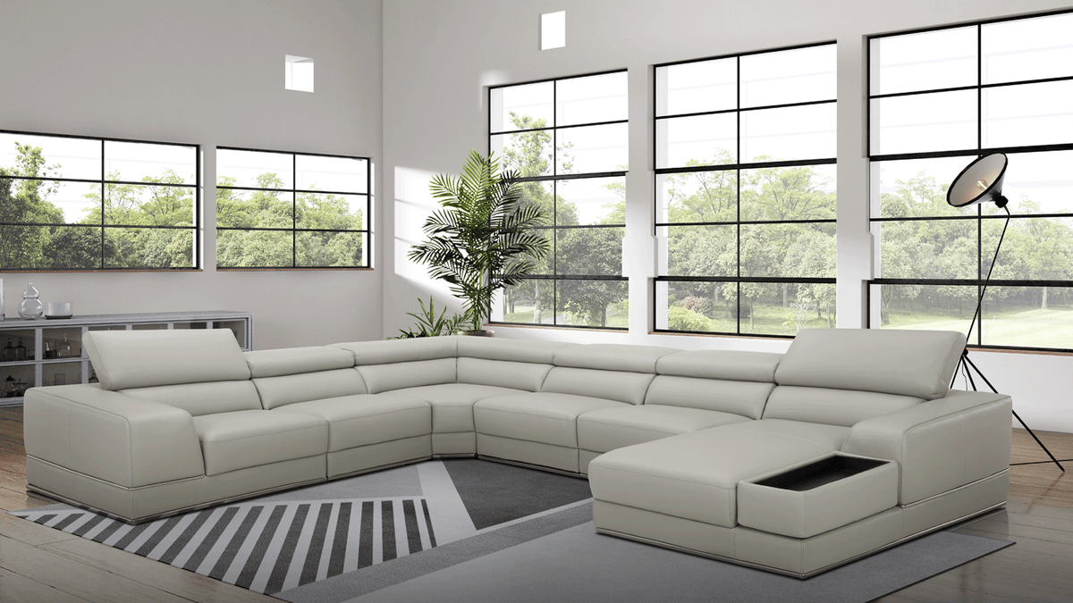 Modern Light Grey Leather Sectional with Adjustable Headrests and Storage Chaise
