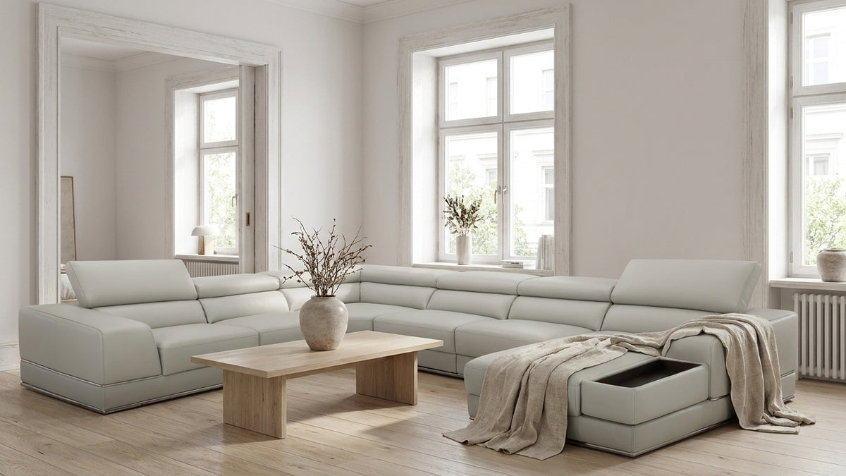 Modern Light Grey Leather Sectional with Adjustable Headrests and Storage Chaise